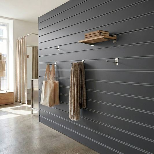 Retail display wall with graphite grey slatwall panels and coordinating grey inserts
