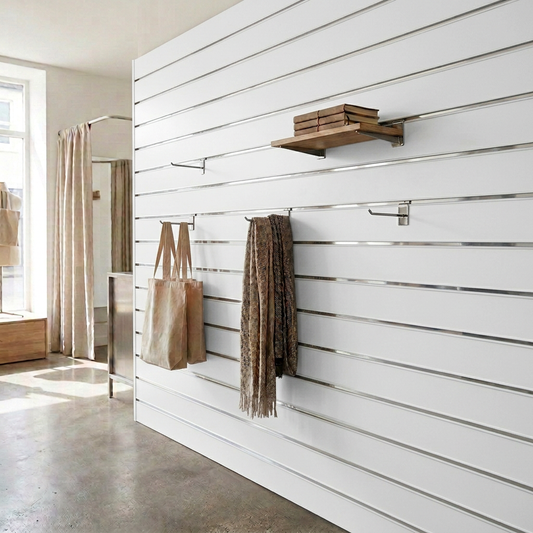 White retail slatwall display with white PVC inserts and reflective mirror strip accents