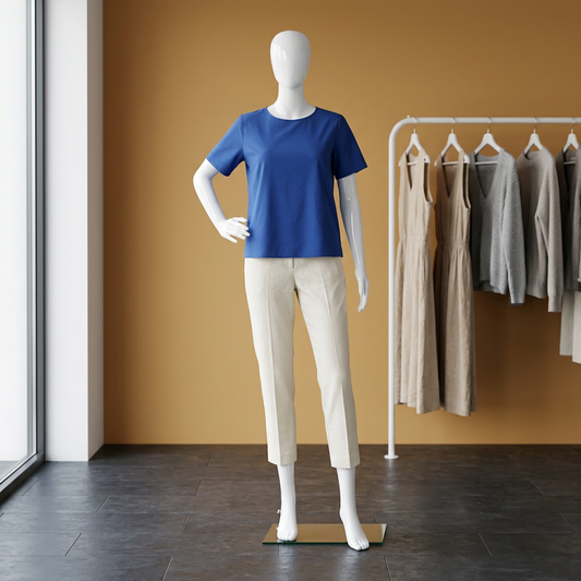Vibe 05 female gloss-white mannequin in an ochre-and-slate boutique