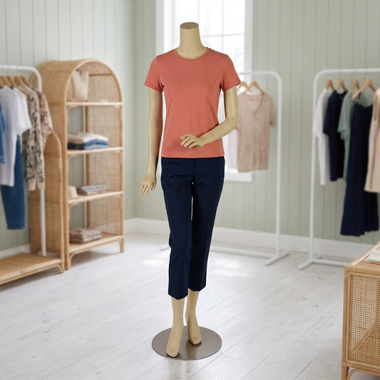 Ziva 04 female skin-tone mannequin in a sage-and-rattan boutique