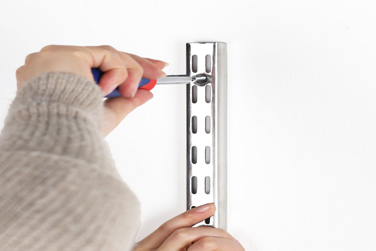5. Screw the top of the Upright(s) to the wall