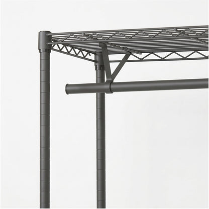 Close-up of a dark gray metal wire storage shelf with two vertical support legs and a horizontal support rod, shown against a plain light gray background.