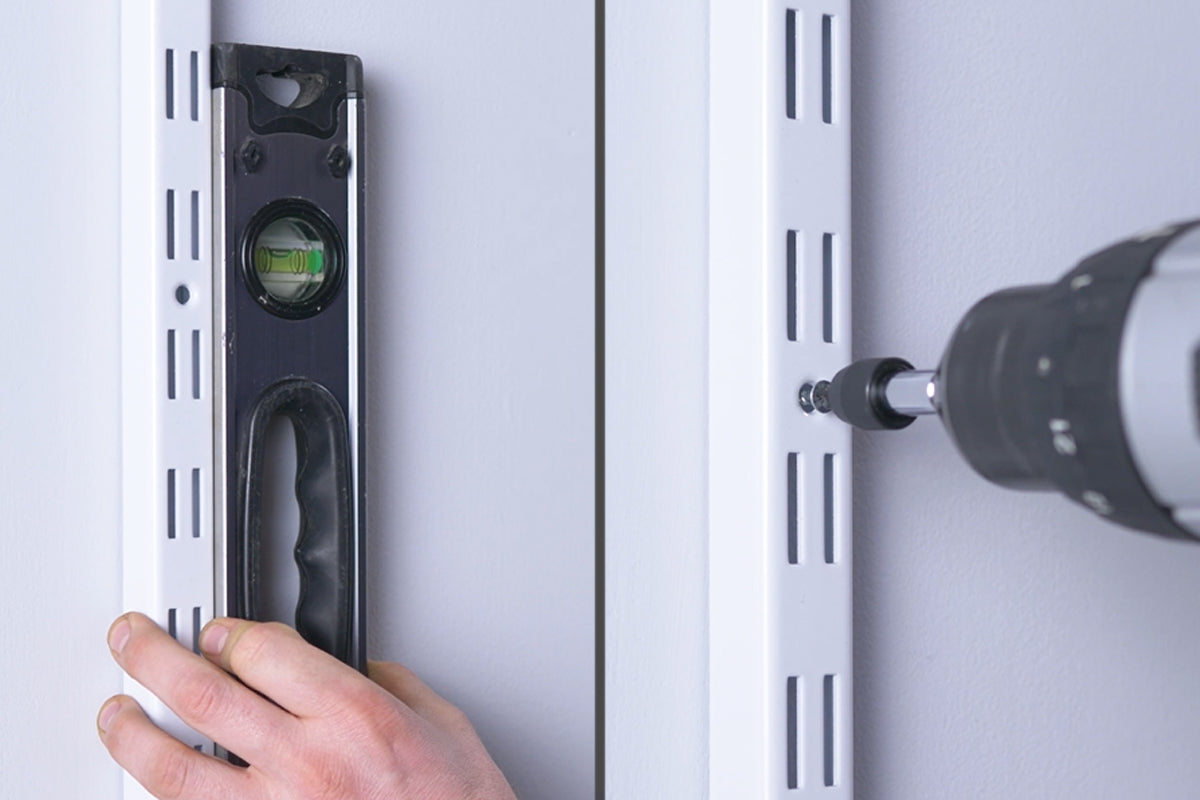 6. Affix Uprights to wall (recommended)