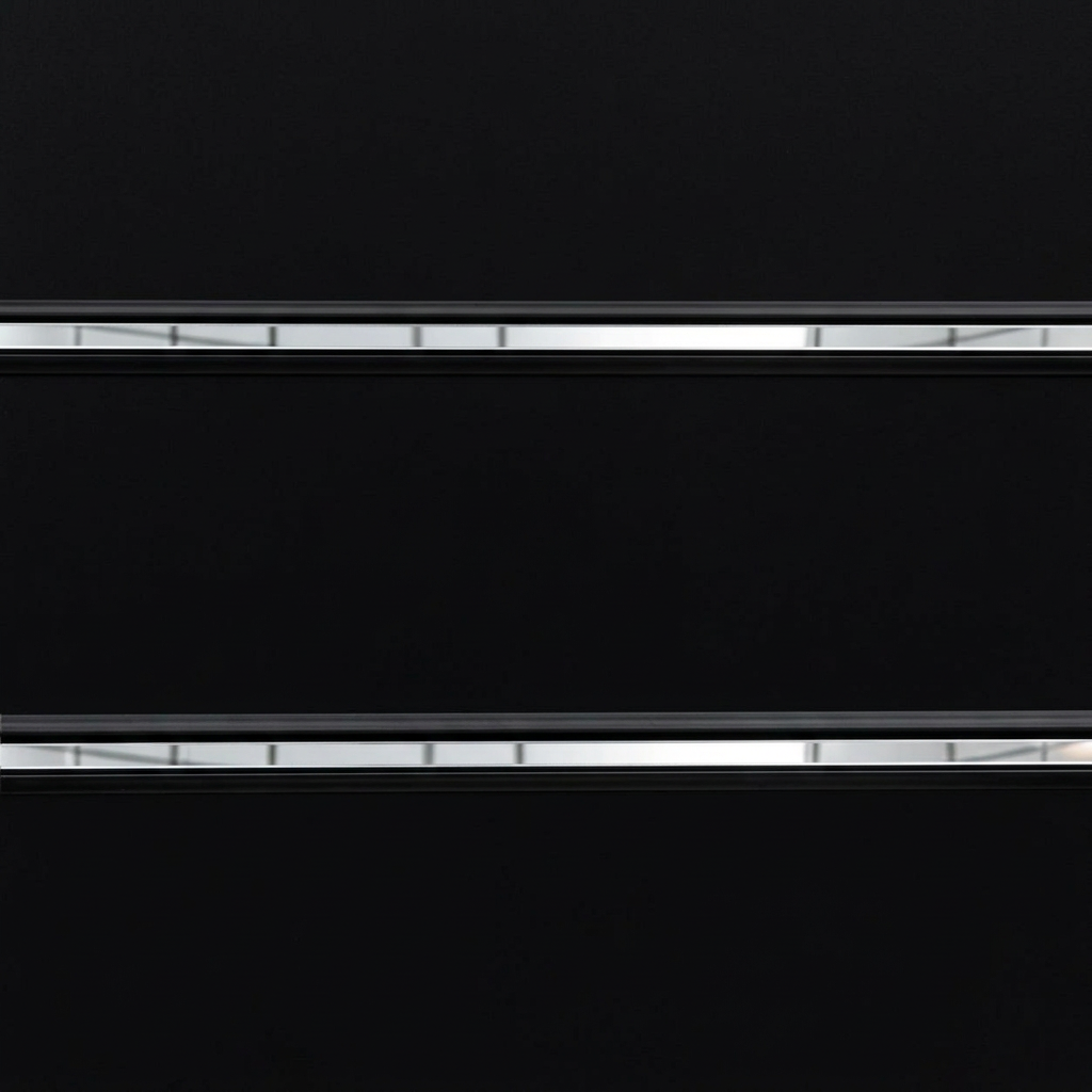 Close-up of black PVC inserts with continuous mirror strips on black slatwall