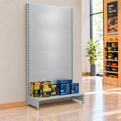 Lifestyle illustration of silver H1800mm plain-panel wall shelving with a single base shelf against a hardware shop wall. Merchandise and end-of-run support not included.