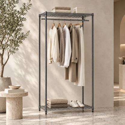 Carbon grey wire clothes rack styled with neutral garments in a minimal concept store with a plaster wall and terrazzo floor