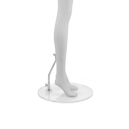 A white mannequin lower body on a round white display base with a small silver hanging accessory, photographed against a plain white background.