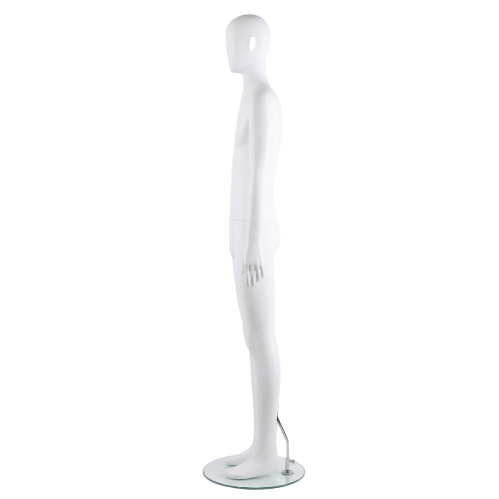 Side view of a white plastic male mannequin on a white background