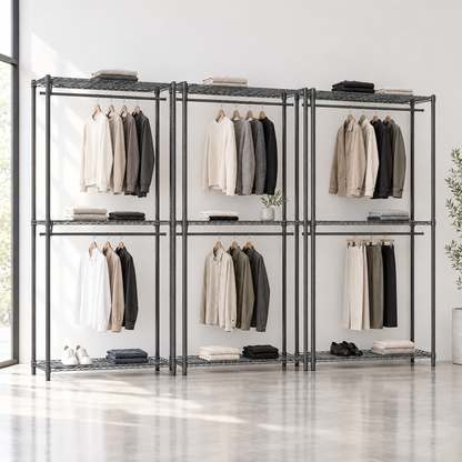 Three carbon grey racks in a minimal boutique