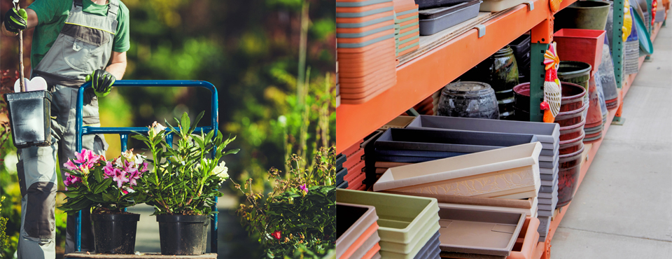 A worker at a garden centre moving plants on a trolley, and heavy-duty shelving with pots and planters